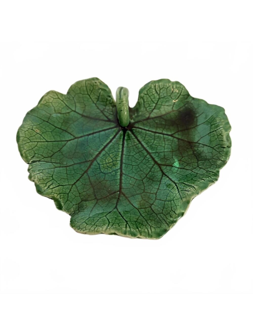 A green majolica ceramic leaf dish by Bordallo Pinheiro.